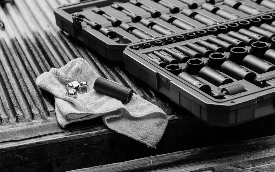 Socket set laid out on a ute tray liner before the first job